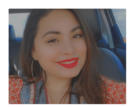 Tianna, smiling in the front seat of a car